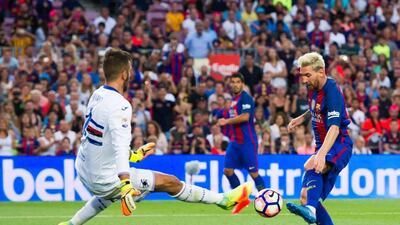 Lionel Messi (R) of Barcelona dribbles around goalkeeper Emiliano Viviano of UC Sampdoria and scores his team’s second goal during the Joan Gamper Trophy match between FC Barcelona and UC Sampdoria at Camp Nou on August 10, 2016 in Barcelona, Spain. Alex Caparros / Getty Images