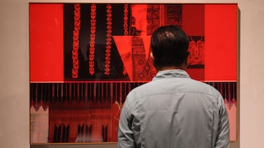 Sila at Maraya Art Centre brings historical examples of tatreez alongside its contemporary interpretations, such as Hazem Harb's Stitching Unity. Chris Whiteoak / The National