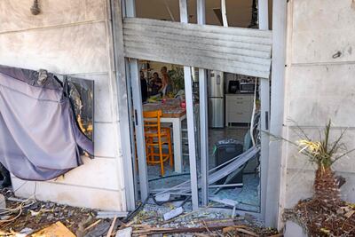Israelis survey the damage in the kitchen after a drone strike launched from Yemen, in Yavne, south of Tel Aviv. AFP