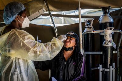 A woman is tested for Covid-19 at Lenasia South Hospital, near Johannesburg, as South Africa faces a surge in cases. AP