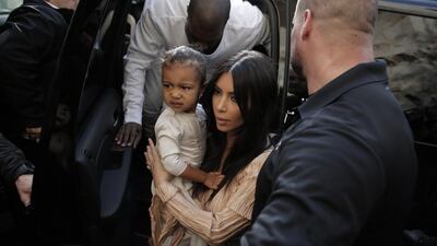 Kim Kardashian with North West. Ahmad Gharabli / AFP