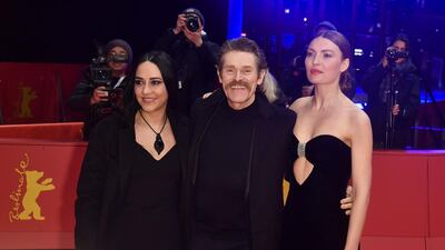 US actor Willem Dafoe (C) poses on the red carpet with his wife Ciada Colagrande and Moldovan actress Cristina Chiriac upon arrival for the premiere of the film 'Siberia' screened in competition on February 24 at the 70th Berlinale film festival in Berlin. AFP