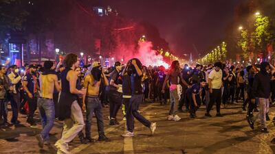 Fans of PSG celebrate on the Champs-Elysees after their team won the Uefa Champions League. EPA