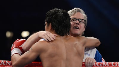 Trainer Freddie Roach gives Manny Pacquiao a hug between rounds during his bout against Timothy Bradley at the MGM Grand Arena in Las Vegas in 2012. Getty