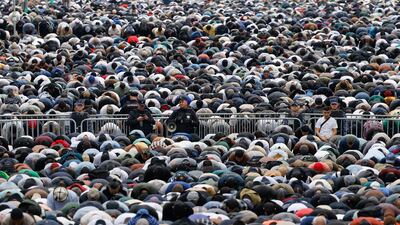 Russian police officers stand guard during Eid Al Adha prayers near Moscow Cathedral Mosque. Reuters