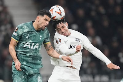 Tottenham's Dominic Solanke, left, challenges for the ball with Frankfurt's Fares Chaibi. AP