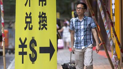 The recent Chinese move is not so much aimed at boosting exports, as a yuan depreciation of less than 5 per cent will have a marginal effect on improving competitiveness. Jerome Favre / EPA