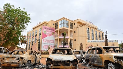 Burnt cars outside the headquarters of the ousted president's Nigerien Party for Democracy and Socialism in Niamey. AFP