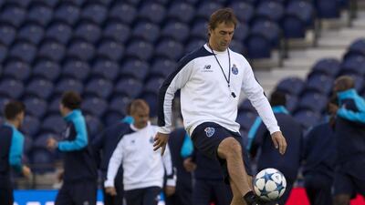Porto’s Spanish coach Julen Lopetegui plays with a ball during a training session at the Dragao Stadium in Porto on October 19, 2015, on the eve of the UEFA Champions League group G football match FC Porto vs Maccabi Tel-Aviv FC. AFP PHOTO/ MIGUEL RIOPA