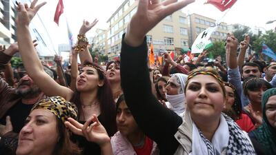 Supporters of pro-Kurdish People's Democracy Party (HDP) celebrate the results of the party as part of the legislative election in Ankara on June 9, 2015. Adem Altan/AFP Photo