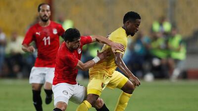 Egypt's Tarek Hamed in action with Guinea's Amadou Diawara. Reuters