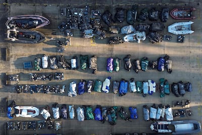An aerial view shows rolled-up inflatable dinghies and outboard engines, believed to have been used by migrants and asylum seekers who were picked up at sea while crossing the English Channel from France to England in January. AFP