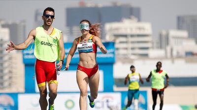 Spain's Lia Beel Quintana and her guide compete in the women's 400m T11 at the World Para Athletics Championships in Dubai on Thursday November 7. EPA