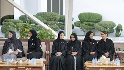 Noura Mohamed Al Kaabi, UAE Minister of Culture and Knowledge Development, second left; Shamma Suhail Al Mazrouei, UAE Minister of State for Youth Affairs, third left; Dr Maitha Salem Al Shamsi, UAE Minister of State, fourth left; Hessa Essa Buhumaid, UAE Minister of Community Development, fifth letf; and Mariam Mohamed Saeed Hareb Al Mehairi, UAE Minister of State for Food Security, right, attend a Sea Palace barza. Ryan Carter / Ministry of Presidential Affairs