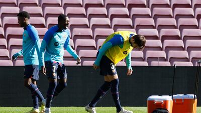 Gerard Pique with Ousmane Dembele and Barcelona teammates during training. Reuters