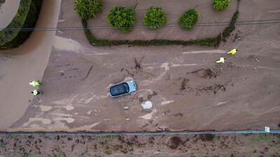 A vehicle trapped by mud and debris at Jameson Lane near the 101 highway in Montecito. AP