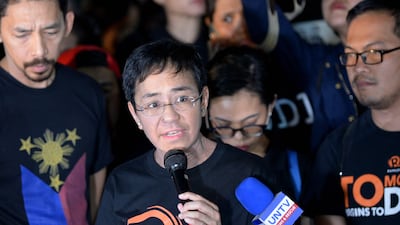 Ressa addresses journalists in Manila after they took to the streets to protest against the Duterte administration's threats to shut down Rappler, in January 2018. AFP