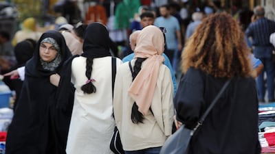 Iranian women, some without the mandatory headscarf, in Tehran. EPA