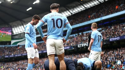 City midfielder Ilkay Gundogan receives treatment after a challenge by Max Killman of Wolves. Getty