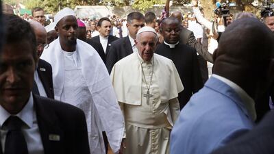 Pope Francis is welcomed by Imam Tiding Moussa Naibi, left, on his visit at the Central Mosque in Bangui's Muslim enclave of PK5, in the capital of Central African Republic. Jerome Delay / AP Photo