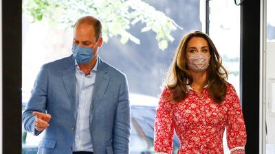 The Duchess of Cambridge wears red floral Calla Dress by Beulah London to arrive at the London Bridge Jobcentre with the Duke of Cambridge on September 15. Getty Images