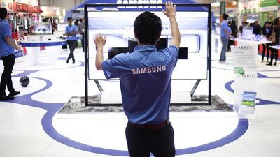 A technician uses hand gestures to operate Samsung’s latest product, the UHDTV Series 9. Lee Hoagland / The National