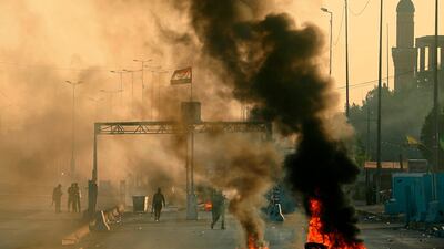 Iraqi security forces fire tear gas to disperse anti-government protesters during a demonstration in Baghdad, Iraq. AP