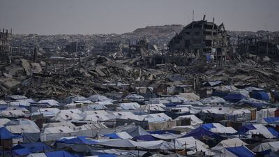 Displaced Palestinians shelter in tents amid the destruction of Gaza. AP
