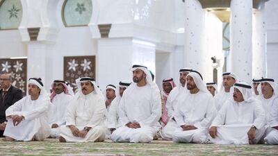 Sheikh Hazza bin Zayed, National Security Advisor and Vice Chairman of the Abu Dhabi Executive Council, left, King Hamad bin Isa Al Khalifa of Bahrain, second left, Sheikh Mohammed bin Zayed Al Nahyan, Crown Prince of Abu Dhabi and Deputy Supreme Commander of the Armed Forces, third left, and Sheikh Suroor bin Mohammed Al Nahyan, fourth left, attend Friday prayers and absentee funeral prayer at the Sheikh Zayed Grand Mosque. Ryan Carter / Crown Prince Court - Abu Dhabi