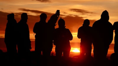 Hikers gather for sunrise on the shortest day of the year, the winter solstice, on Brocken mountain in Schierke, Germany. AP