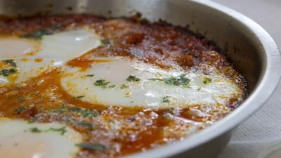 Shakshouka is pictured at Baker & Spice cafe in the Dubai Marina. The dish contains four eggs poached in tomato, roasted red peppers and red chilli sauce and is extremely popular both on weekdays and weekends. It is often accompanied by french farmhouse bread. Razan Alzayani / The National