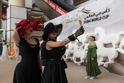 The 30th Dubai World Cup at Meydan Racecourse in Dubai; Sedra Samer and Nasab Al Jurdy take a selfie on arrival. Antonije Robertson / The National