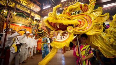 Dragon dancers perform in Kuala Lumpur, Malaysia. A Cepa between the Asean country and the UAE aims to ease tariffs and boost trade. AP