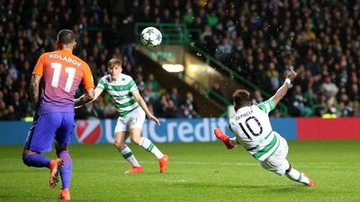 Celtic’s Moussa Dembele, right, scores his side’s third goal of the Champions League match against Manchester City. Jane Barlow / AP