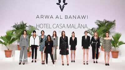 Saudi-born designer Arwa Al Banawi, front, with models. Stuart C Wilson / Getty Images