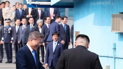 North Korean leader Kim Jong-un crosses the military demarcation line to meet with South Korean president Moon Jae-in. Korea Summit Press Pool via AP