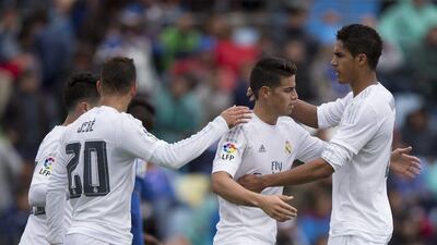 James Rodriguez (2ndR) of Real Madrid CF celebrates scoring their fourth goal with teammates Raphael Varane (R) and Jese Rodriguez (2ndL) during the La Liga match between Getafe CF and Real Madrid CF at Coliseum Alfonso Perez on April 16, 2016 in Getafe, Spain. (Photo by Gonzalo Arroyo Moreno/Getty Images)