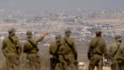 Israeli soldiers survey the ruins of the Gaza Strip. The UAE condemned statements by Israeli Prime Minister Benjamin Netanyahu about a Greater Israel. Getty Images