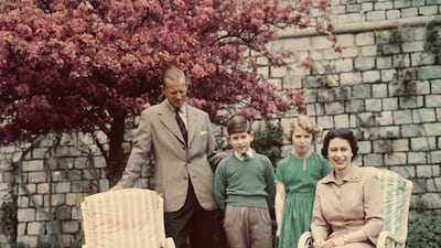 Prince Philip, Prince Charles, Princess Anne and Queen Elizabeth in the gardens of Windsor Castle in 1959.