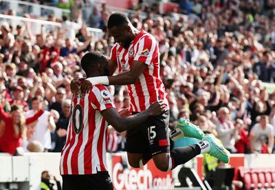 Brentford's Josh Dasilva, left, celebrates scoring their winner against Nottingham Forest with Frank Onyeka. Reuters