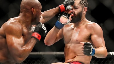 Kamaru Usman of Nigeria punches Jorge Masvidal of the United States. Getty