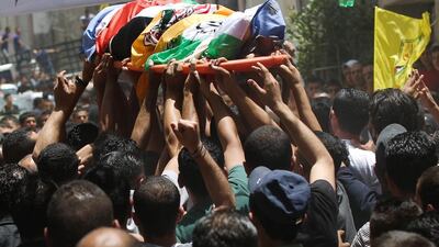 Palestinians carry the body of Ahmad Sabbarin from Jalazoun refugee camp during his funeral in the West Bank near Ramallah on16 June 2014. Sabbarin was killed by Israeli soldiers in the refugee camp during a confrontation with protesters amid large-scale arrests of Palestinians asIsrael searched for three abducted teenagers. EPA/ATEF SAFADI