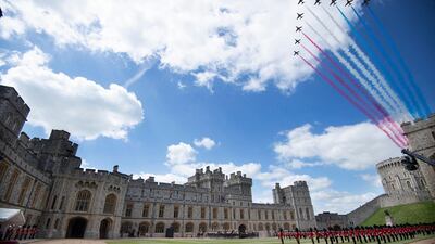 The Red Arrows conduct a flypast for Queen Elizabeth II's official birthday celebrations at Windsor Castle. AFP