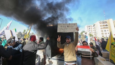 Iraqi protesters set ablaze a sentry box in front of the US embassy building in the capital Baghdad on Tuesday. AFP