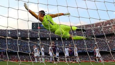 PSV Eindhoven's Jeroen Zoet can only watch as Lionel Messi's free kick flies into the net, putting Barcelona 1-0 up. Reuters
