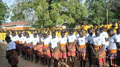 Pupils welcome officials from Dubai Cares with a prayer. St. Katherine Secondary School is one of 40 schools in 39 districts across Uganda to share in a US$1,188,280 donation from Dubai Cares aimed at promoting girls’ participation in stem subjects. Roberta Pennington / The National
