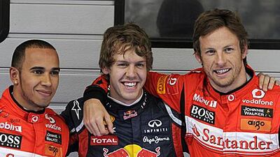 Sebastian Vettel, centre, was more subdued in celebrating securing pole for the third time in three races.