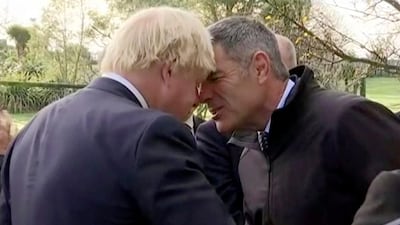 In this video screen grab, British foreign secretary Boris Johnson, left, performs a hongi, a traditional Maori greeting, with New Zealand's minister for primary industries, Nathan Guy, in Kaikoura, New Zealand on July 24, 2017. TVNZ Pool via AP