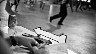 A member of the Jafiliyah Basketball Committee notes down score.