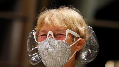 A woman wears orchestra conductor Ivan Fischer's acoustic mask at the Mupa Budapest. Reuters